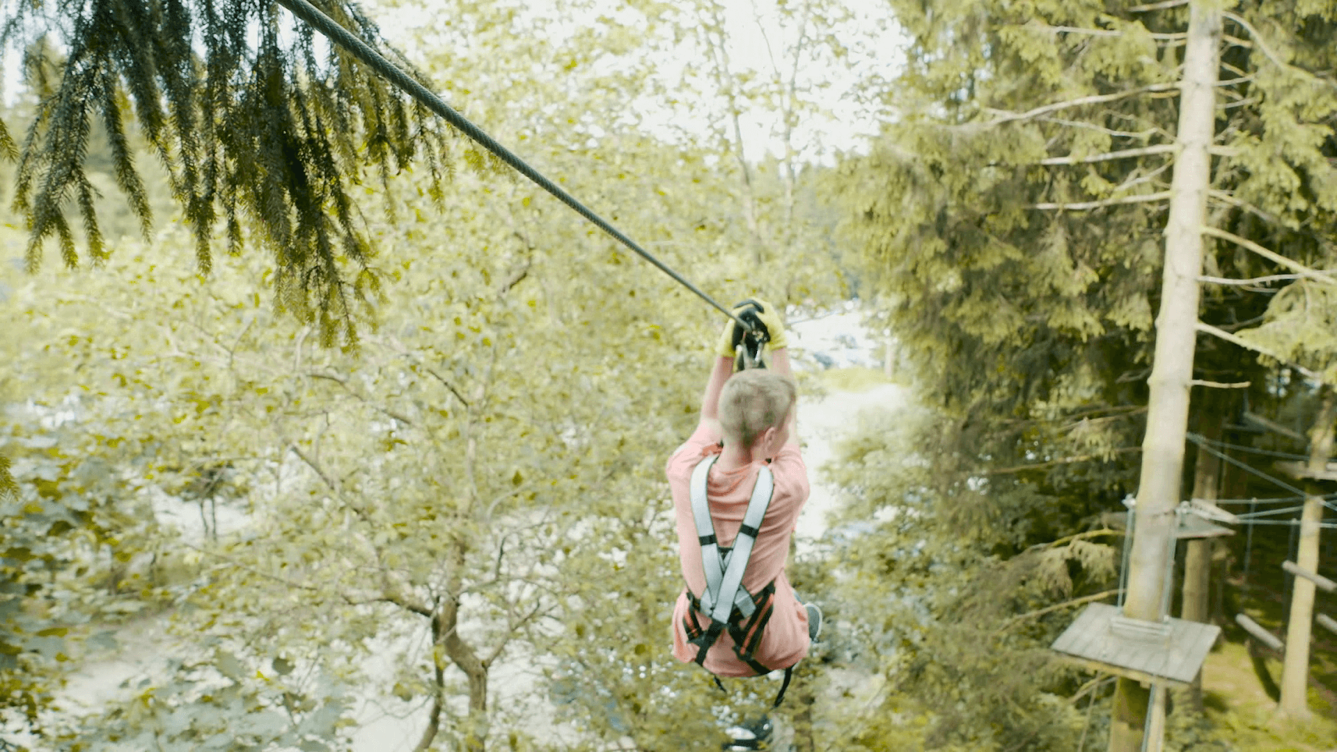 Child riding cable car in Kletterwald Winterberg on Erlebnisberg Kappe